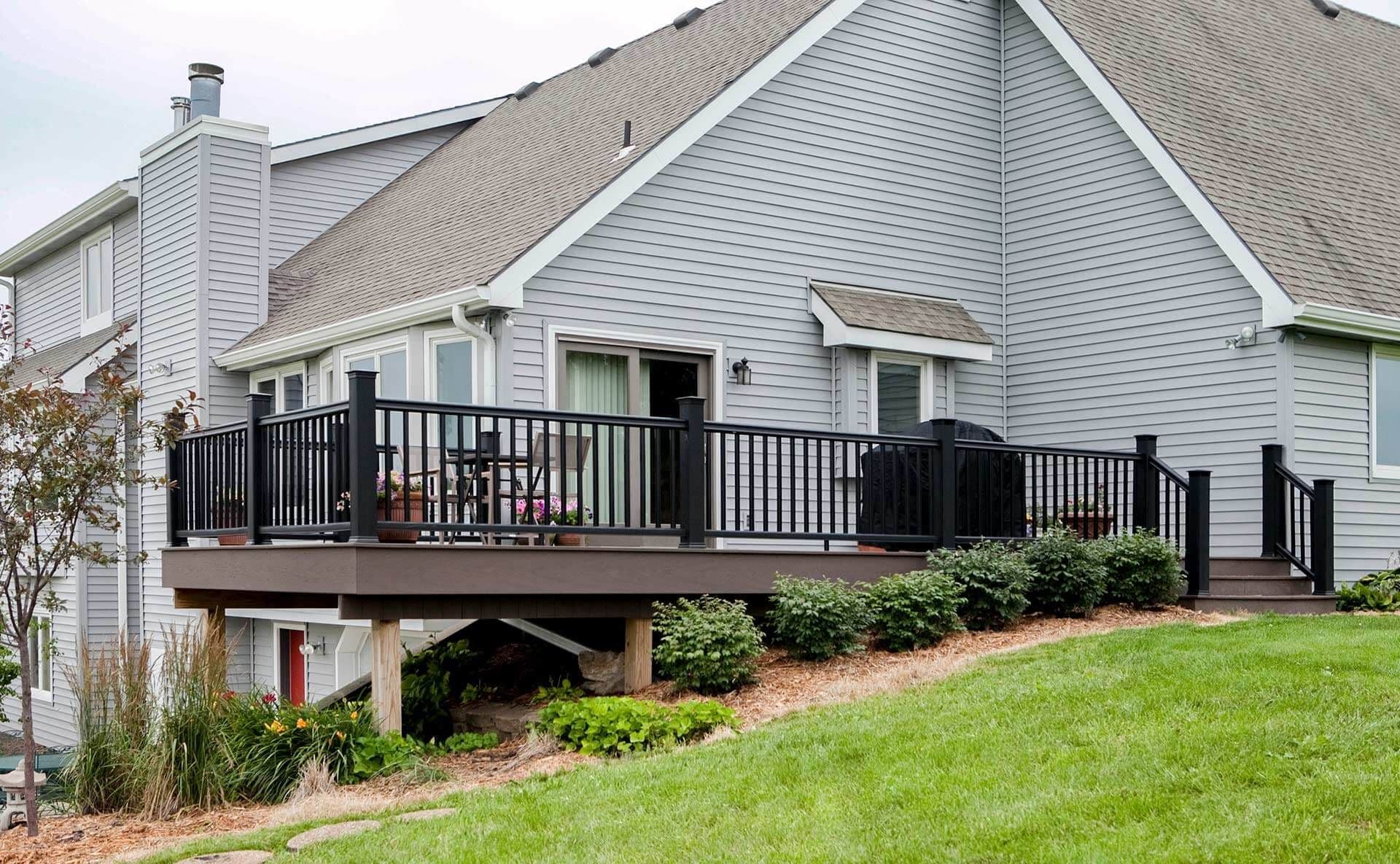 Blue house with black fence