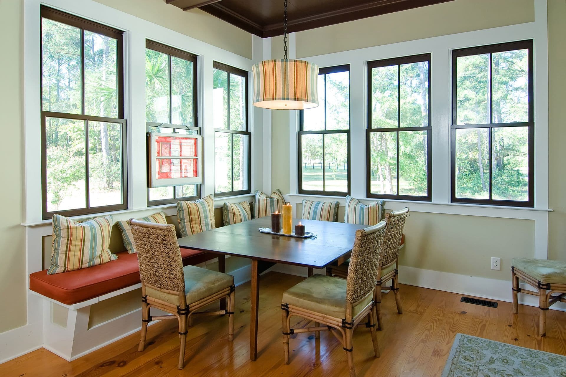 dining-room-with-banquet-seating-and-a-wall-of-windows