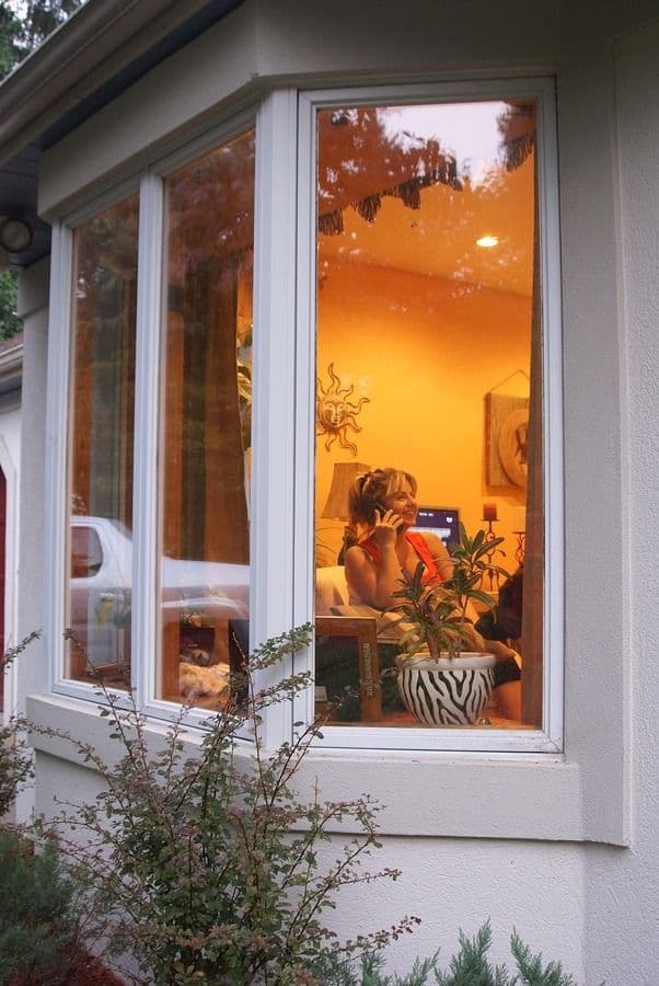 in windows lit up person women